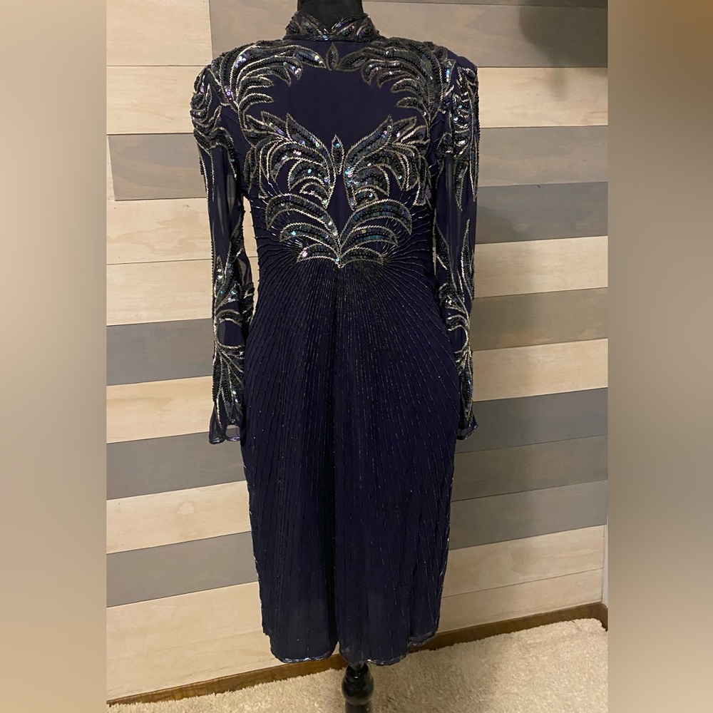 Short silk evening, dress with oilspill and silver beading. By Carina , M.